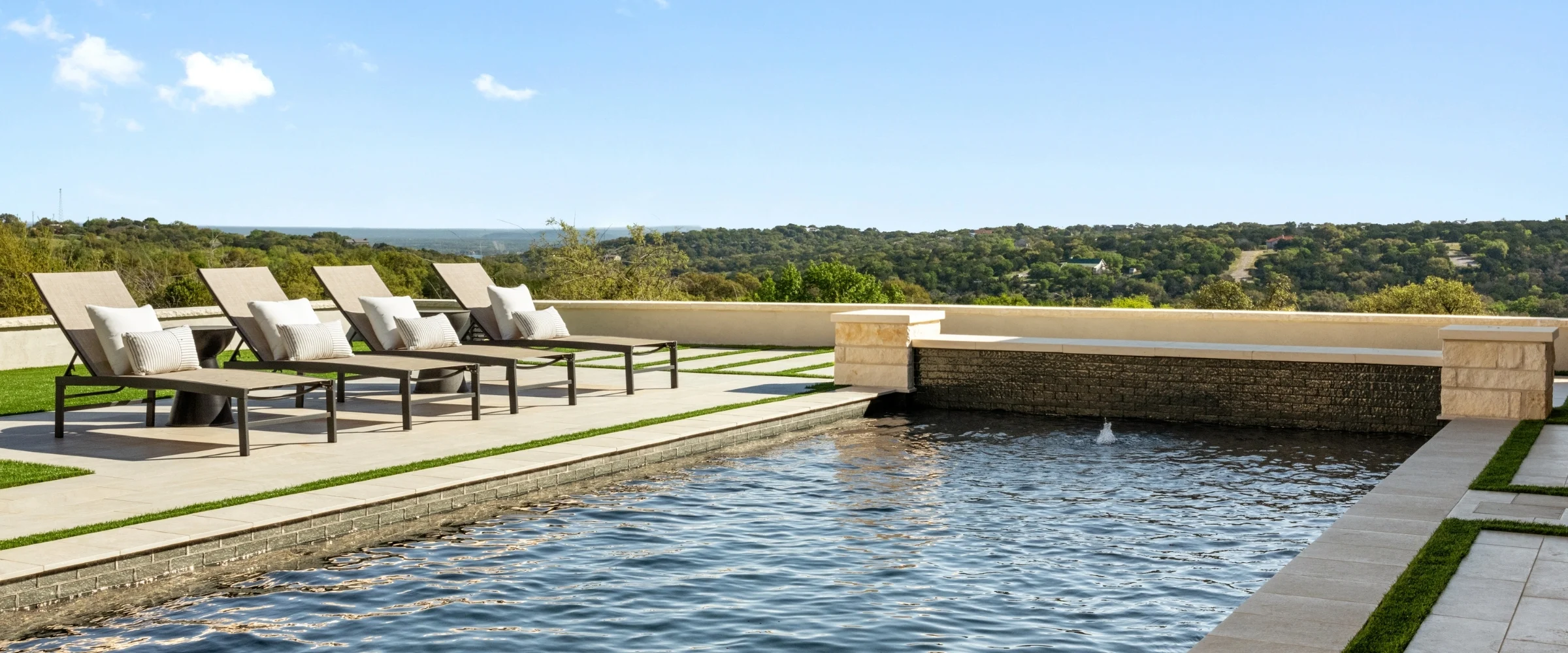 Pool terrace with loungers overlooking the Hill Country
